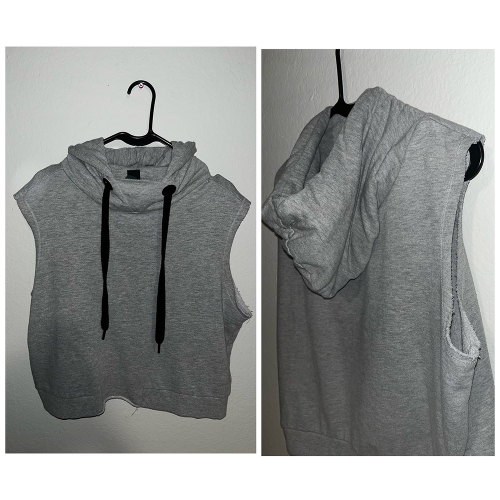 Gray sleeveless hoodie with low cut sides